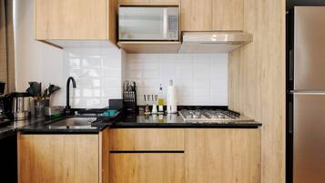 Fridge, microwave, stovetop, cookware/dishes/utensils