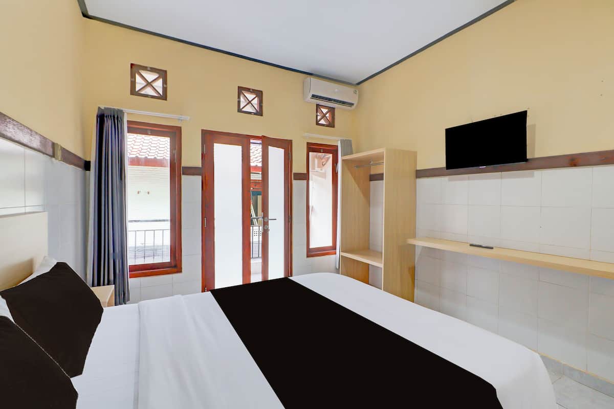Suite Deluxe | Espacio para trabajar con un portátil, wifi gratis, ropa de cama
