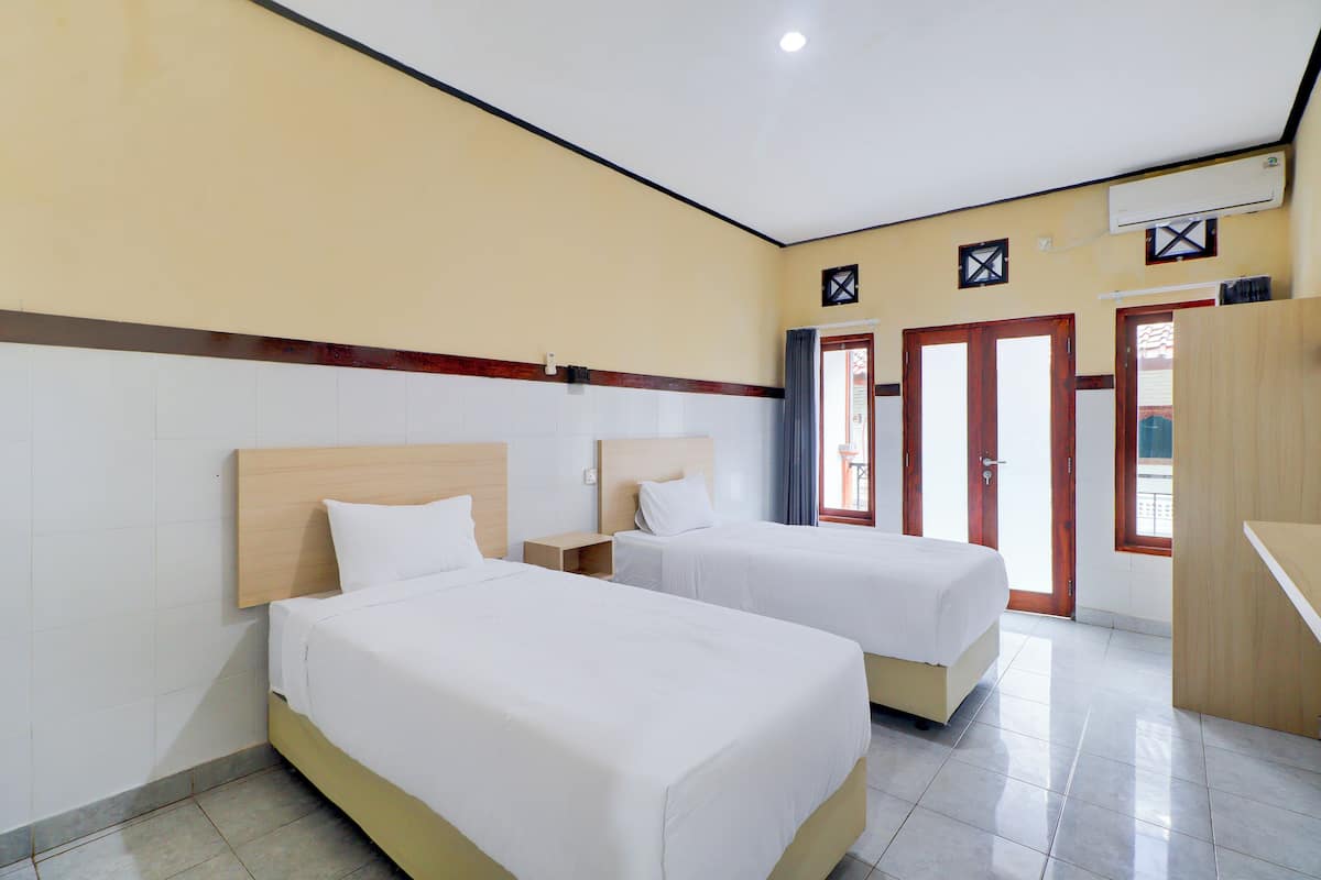 Habitación Deluxe con 2 camas individuales | Ropa de cama de alta calidad, wifi gratis y ropa de cama