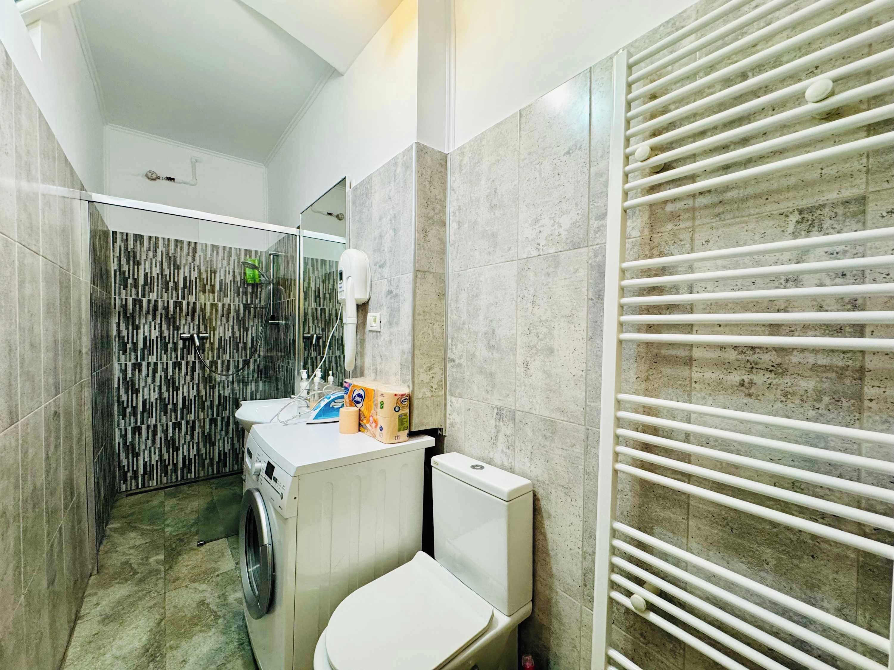 Shower, hair dryer, towels, shampoo