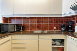 Microwave, stovetop, dining tables