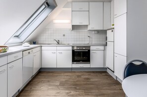 Microwave, oven, stovetop, dining tables