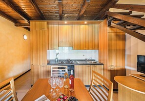 Apartment | Private kitchen | Electric kettle, high chair - I Girasoli C14 by Wonderful Italy (Toscolano Maderno)