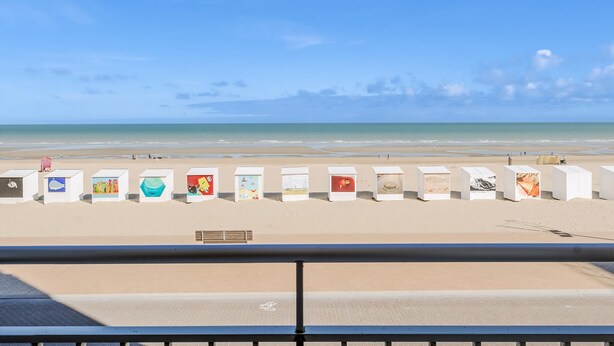 A beach with white structures displaying artwork. - 3 bedroom accommodation in Sint Idesbald (Sint Idesbald)