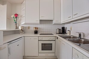 Oven, stovetop, coffee/tea maker, dining tables