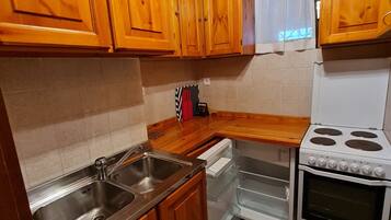 Apartamento | Cozinha privada | Geladeira, fogão, chaleira elétrica