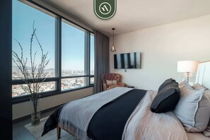 1 bedroom, desk, iron/ironing board, travel crib