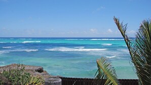 A coastal view with turquoise waters and a clear sky. - Inch By Inch 3 Bedroom Home by Bluescape (Silver Sands)