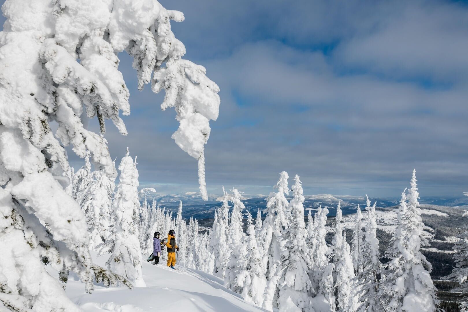 A snowy mountain landscape with a clear sky.