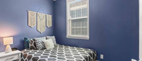 The Blue Room has a queen bed, closet, and ceiling fan for cool, comfy, restful nights.