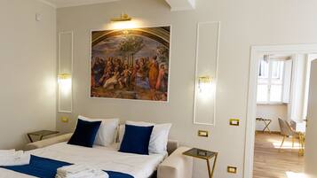A hotel room with a large bed, two bedside tables, a painting on the wall, and a view of the adjacent room.