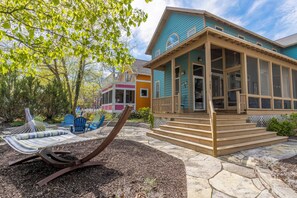 A house with a porch, a hammock, and outdoor seating. - Perfectly Curated Resort Home with Rooftop Deck & Golf Cart (Michigan City, IN 46360)