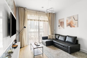 TV - Cozy 1BR Apartment | Close to Mall, Metro, and Dining (Dubai)