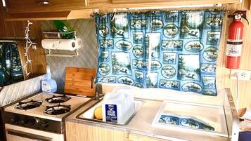 Fridge, stovetop, coffee/tea maker, cookware/dishes/utensils