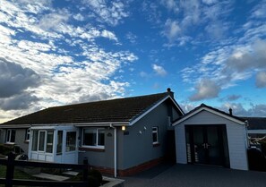 Cozy single-story home with a pitched roof and attached garage.