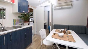 Mobile Home, 2 Bedrooms, Terrace | Dining room - The Charming Mare Pineta Mobile Home 4 Persons (Comacchio)