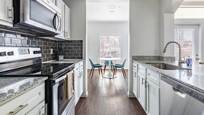 Fridge, dining tables - Landing | Spectacular 1BD, Gym (Fort Worth)
