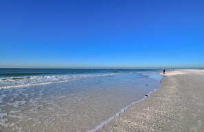A beach with clear skies and calm waters.