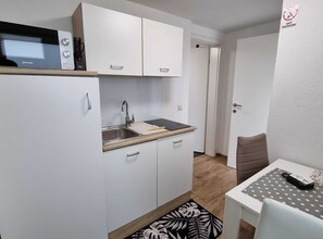 Fridge, microwave, cookware/dishes/utensils