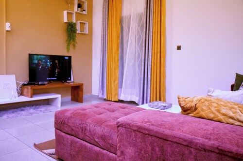 Bright, cozy apartment, where mustard yellow creates a warm ambience.