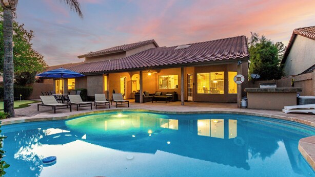 A house with a swimming pool, outdoor seating, and a patio area. - Spanish Wells Scottsdale Oasis (Scottsdale)