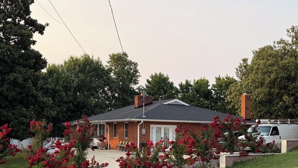 A single-story house with a brick exterior, a front porch, and a garage. - National Harbor Property 1 (Fort Washington)