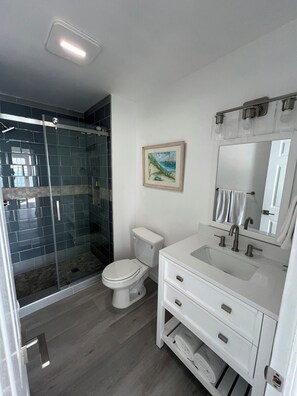 Shower, hair dryer, towels, soap