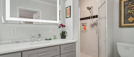 Shower, hair dryer, towels, soap