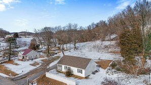 A residential area with houses, a road, and a snowy landscape. - Affordable, Private, Single Level House Steps From Hard Rock Casino Pet Friendly (Bristol)