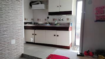 Fridge, microwave, stovetop, coffee/tea maker