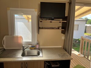 Fridge, microwave, stovetop, coffee/tea maker