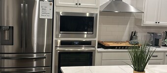 Spacious, 5-bedroom house w/ theater room, outdoor patio/TV, 2024 new build