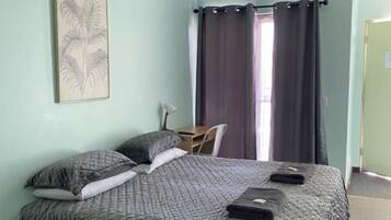 Laptop workspace, bed sheets
