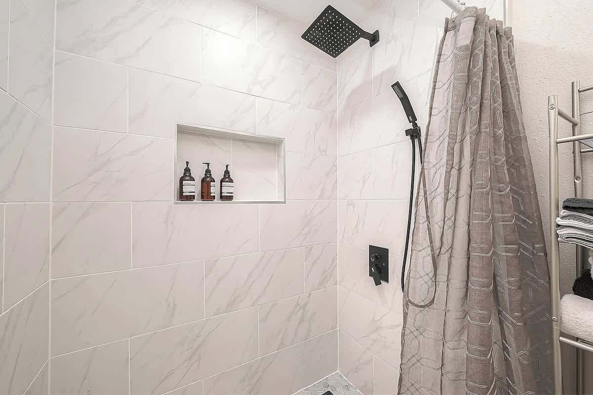 Shower, hair dryer, towels, shampoo