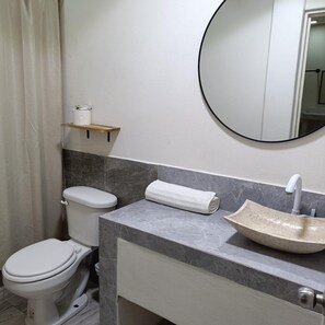 Family Studio Suite | Bathroom | Shower, toilet paper