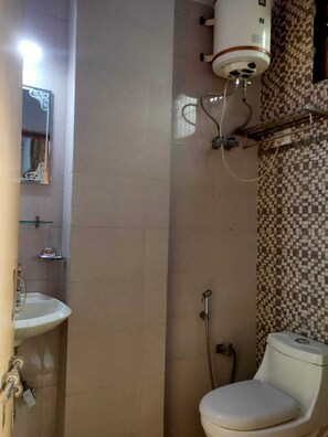 Standard Double Room, City View | Bathroom | Shower, free toiletries, towels, soap - COSY Rooms  (New Delhi)