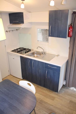 Fridge, stovetop, high chair, cookware/dishes/utensils