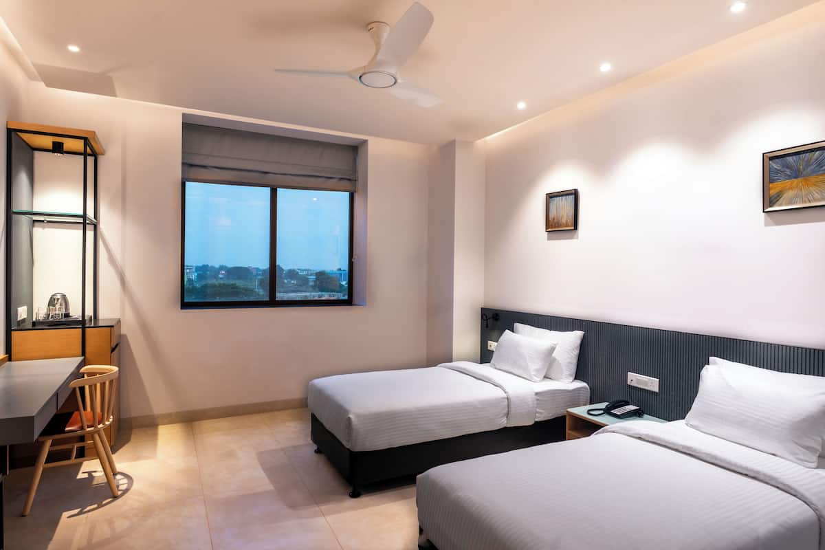 Comfort Room, 2 Twin Beds, Private Bathroom, City View | Frette Italian sheets, premium bedding, in-room safe, blackout drapes