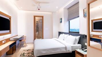 Deluxe Room, 1 King Bed, Private Bathroom, City View | Frette Italian sheets, premium bedding, in-room safe, blackout drapes