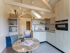 Microwave, oven, dishwasher, dining tables