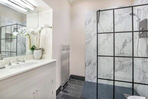 Shower, hair dryer, towels, toilet paper