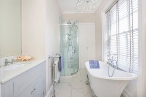 Shower, hair dryer, towels, toilet paper