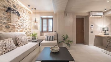 Superior Apartment | Living area | 40-inch flat-screen TV with digital channels