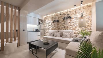 Superior Apartment | Living area | 40-inch flat-screen TV with digital channels