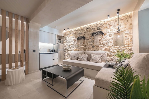 Superior Apartment | Living area | 40-inch flat-screen TV with digital channels