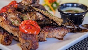 Grilled meat with a side of vegetables and a dipping sauce. - Crux hotel  (Kampala)