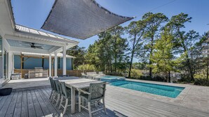 A wooden deck with a pool, outdoor furniture, and a covered area with a ceiling fan. - Tranquility & Nearby Beach Access: Private Oasis (Santa Rosa Beach)