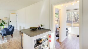 A modern kitchen with a wooden countertop, a built-in oven, and a fire extinguisher. - Mtn Views + On-site Hiking Trails: Catskills Cabin (Round Top)