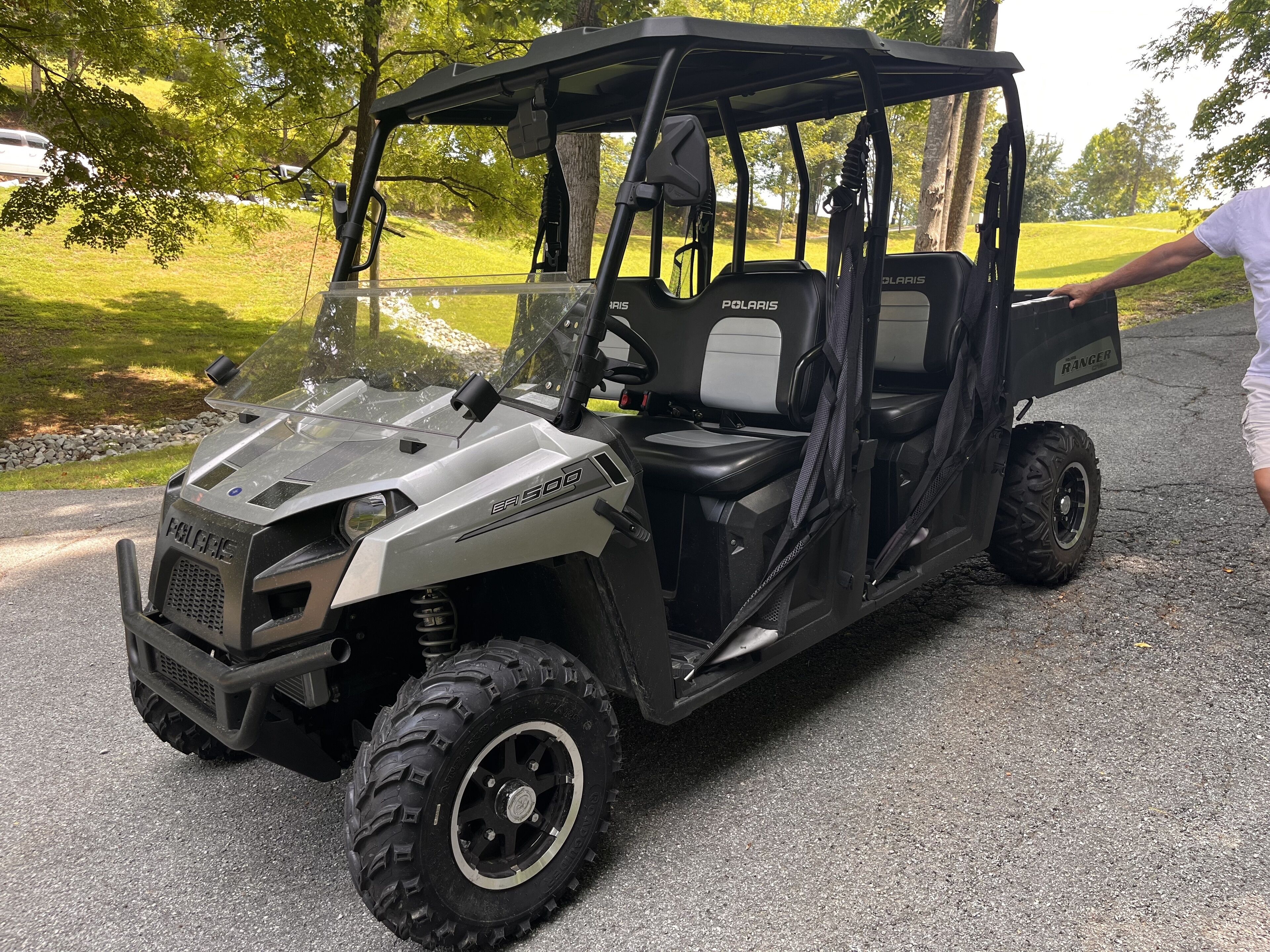 A Polaris ER500 utility vehicle parked on a paved surface.