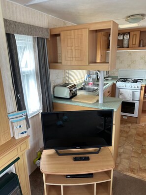 Cabin | Private kitchen | Fridge, microwave, oven, stovetop - 2-bed Ingoldmells Caravan - Pet Friendly & Decking (Skegness)
